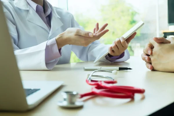 Close-up shot of an actual plastic surgery discussion between a patient and a cosmetic surgeon