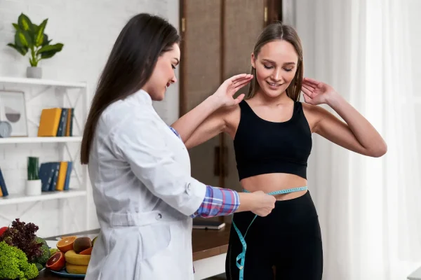 Concierge dietician checking the weight loss progress of her patient during liraglutide therapy