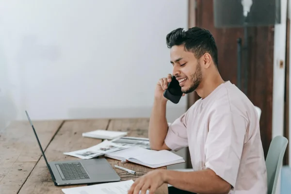 Man calling his doctor after suspecting that his tummy tuck stitches has popped