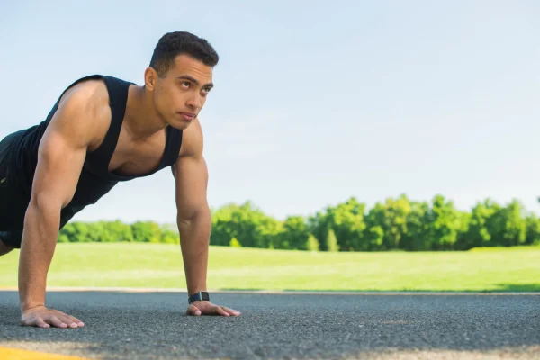Man doing warm ups before exercising after tummy tuck
