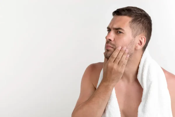 Man inspecting face after Botox injection