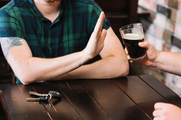 Man refusing to drink alcohol after getting Botox