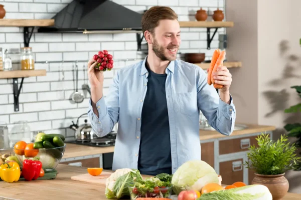Man surrounded with vegetables and fruits after PRP hair treatment