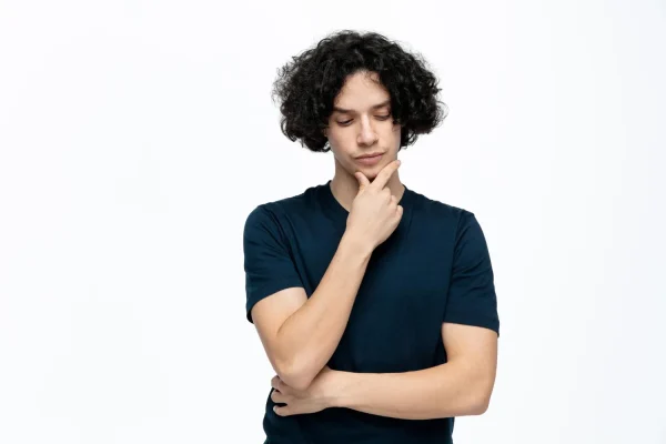 Man wearing dark-colored shirt and thinking about failed filler results