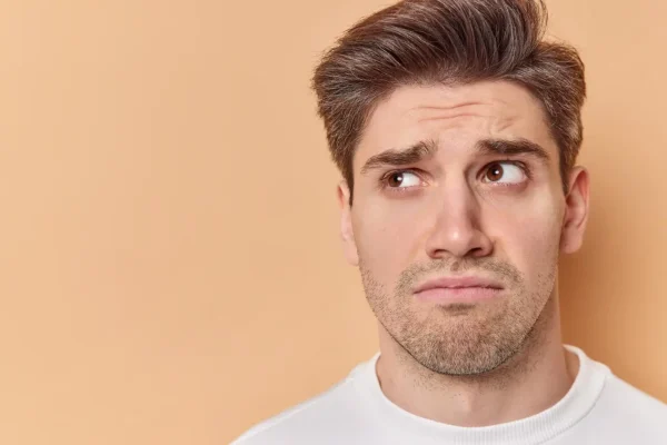 Man wondering about how many Botox should be used on his frown lines
