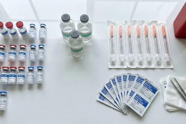 Organized peptide stacking research workspace with vials and supplies