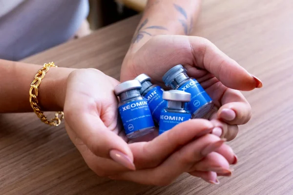 Person holding bottles of Xeomin Botox