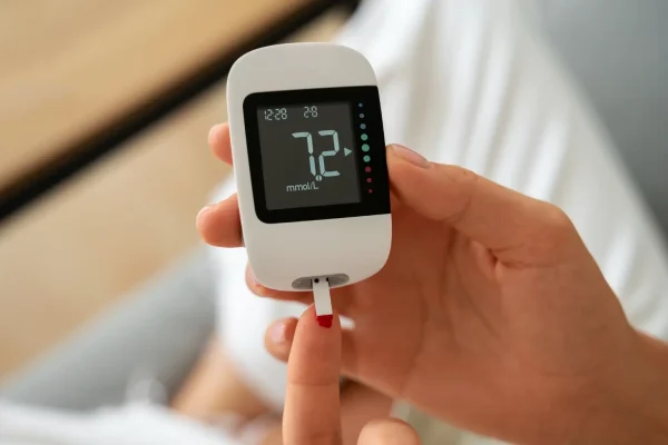 Person monitoring their glucose level before GLP 1 program