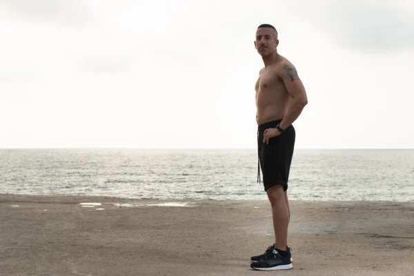 Man enjoying the results of his liposuction on the many areas of his body