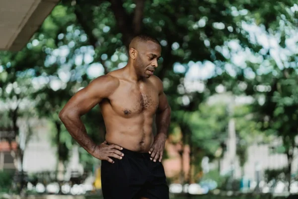 Man exercising outside to maintain his high def lipo results