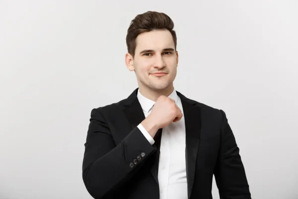 Man in a suit flexing his removed frown lines after getting Botox