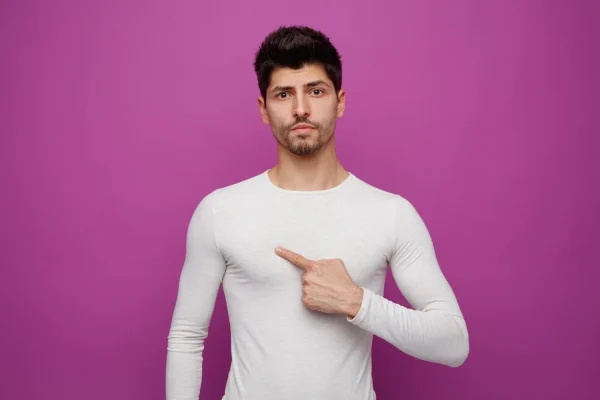 Man pointing to himself thinking if he qualifies as a candidate for PRP skin tightening procedure