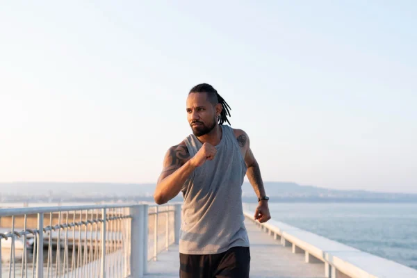 Man running and exercising after tummy tuck recovery