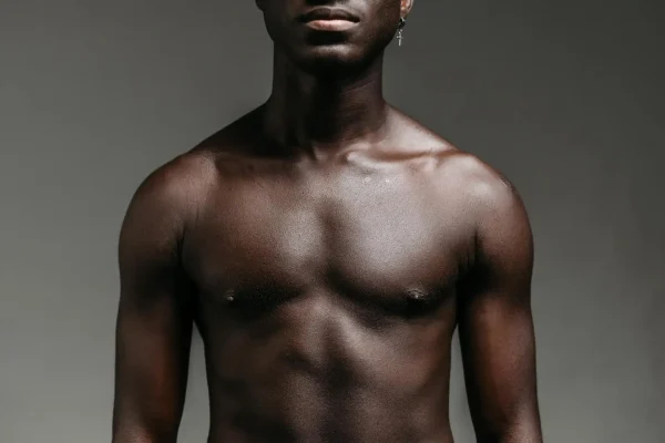 Medium shot of a man's chest and abdomen after recovering from abdominoplasty
