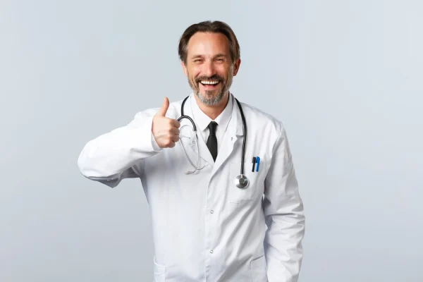 Plastic surgeon doing a thumbs up pose
