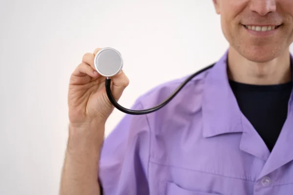 Plastic surgeon getting ready to assess a patient for HD liposuction