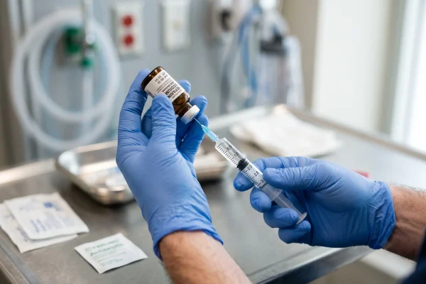 Provider preparing a glutathione injection using sterile clinical technique