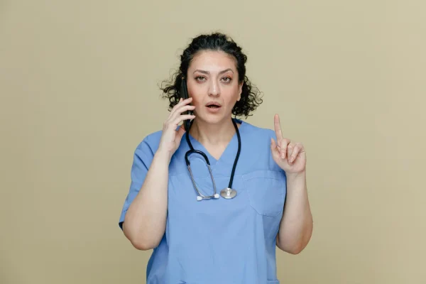 Surgeon talking to a patient on the phone about reversing PDO thread lifts
