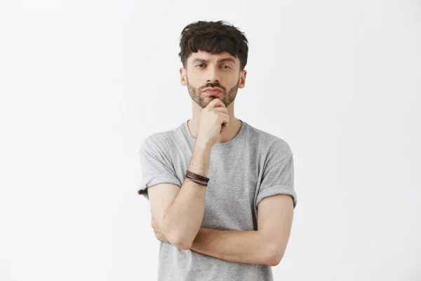 A thoughtful man considers the decision of sourcing medical products like Epitalon reliably and safely, ensuring purity and authenticity