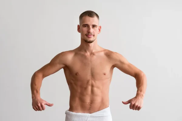 Confident man showcasing body contouring results after successful plastic surgery recovery with social support