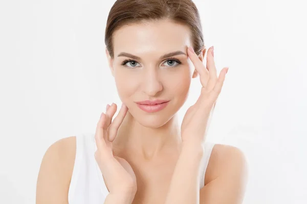 Macro woman face with no wrinkles on forehead skin care