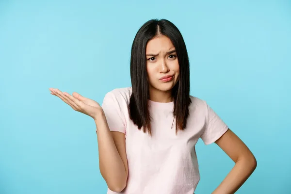 Woman comparing non-surgical versus traditional tummy tuck options