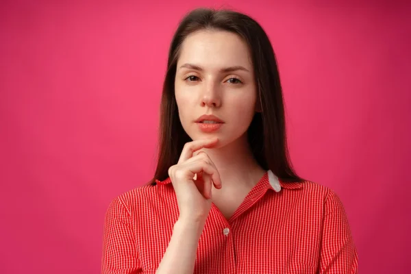 Woman contemplating preparation steps before her FaceTite skin tightening procedure