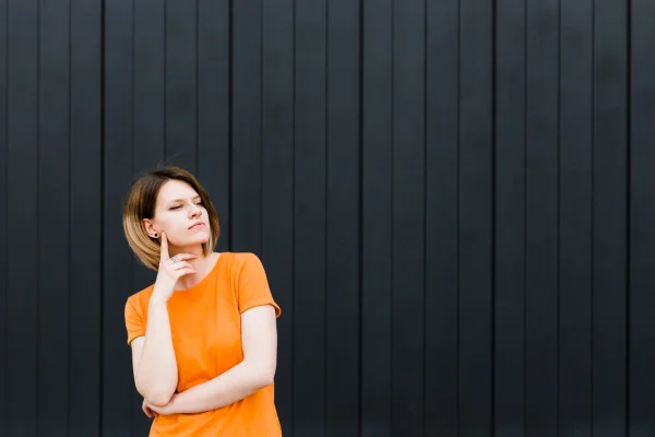 Woman touching her chin while learning about the neck lipo procedure