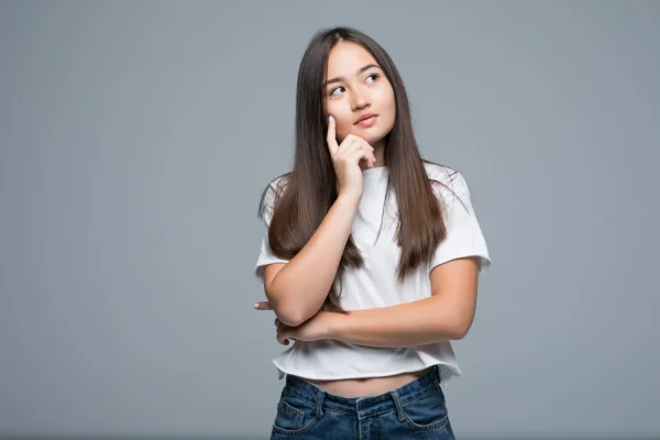 Woman with a thoughtful expression considering whether Selank can actually support her weight loss
