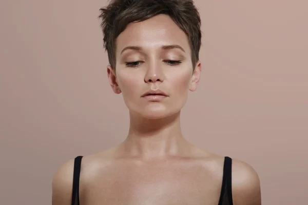 Beauty woman with ideal skin looking down