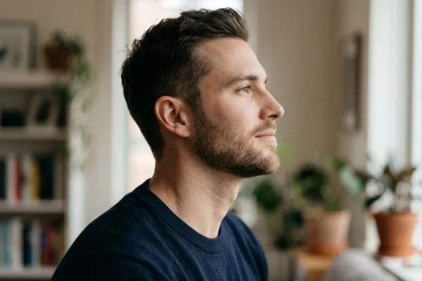 Close-up of a man’s contoured jaw and neck following a fat removal procedure.
