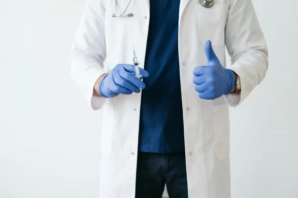 doctor holding a syringe