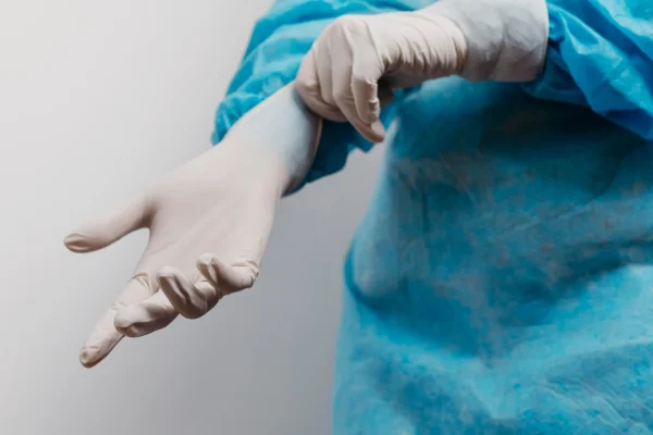 doctor wearing surgical gloves
