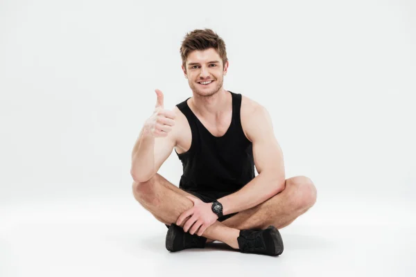 a man sitting down in white background