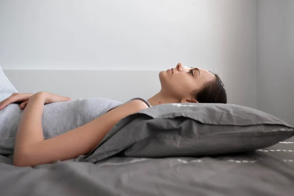 Medium shot woman laying on pillow