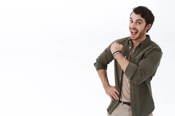 Optimistic happy and active young man encouraging keep going, fist pump cheerfully and smiling, boosting confidence