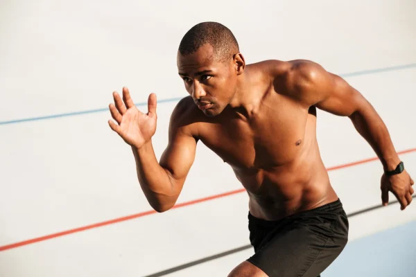 Portrait of a half naked muscular sportsman running