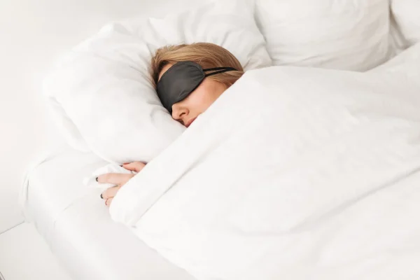 Portrait of lady sleeping in bed at home After Liposuction