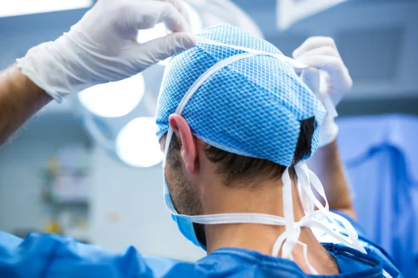 Surgeon wearing mask in operation room at hospital