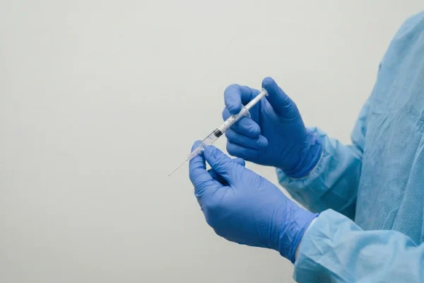 surgeon with syringe