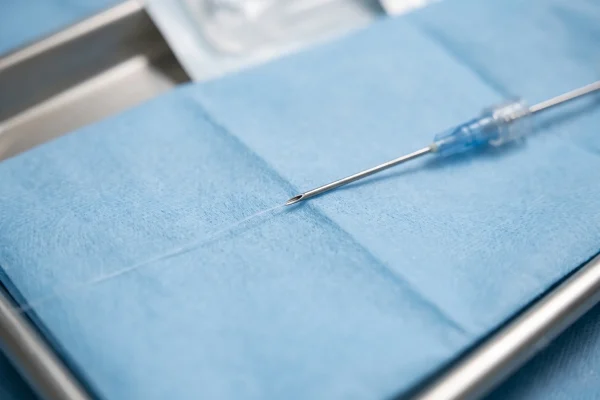 Thin PDO thread and cannula used for a smooth thread treatment, close-up