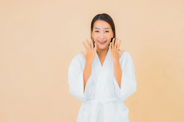 woman wearing bathrobe with smile