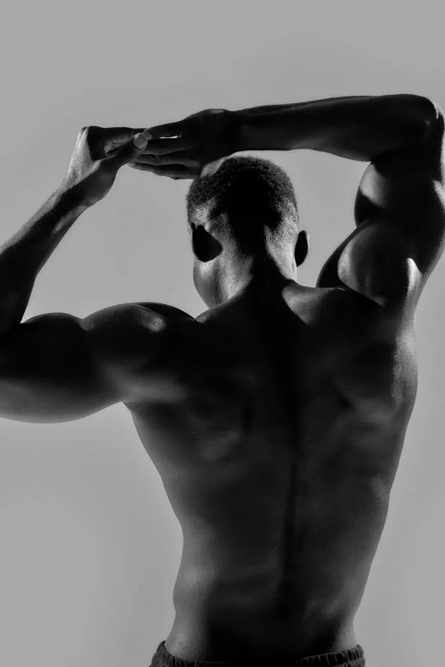 back view of male model, flexing back muscles