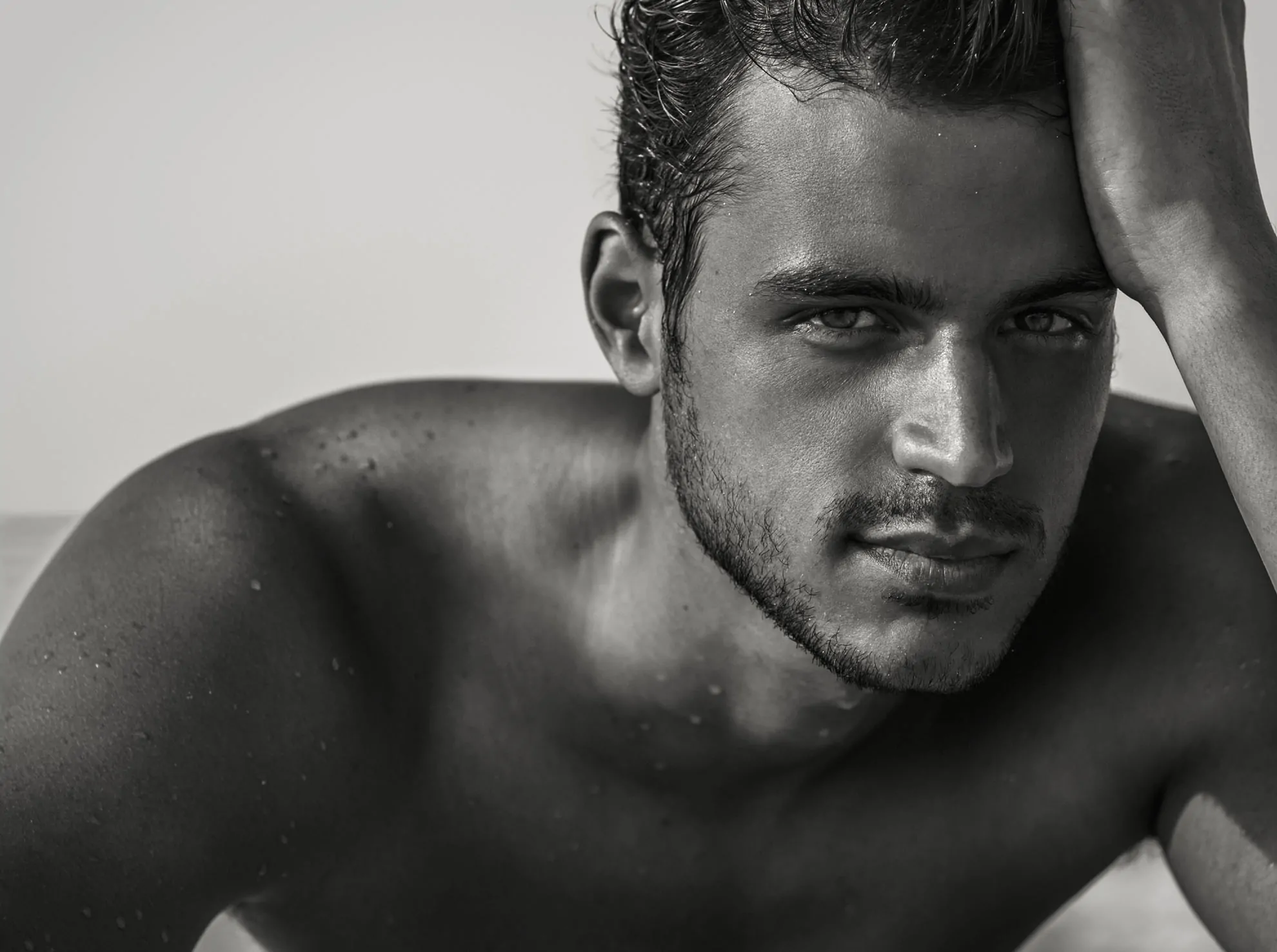 Black and white portrait of a pensive man after plastic surgery
