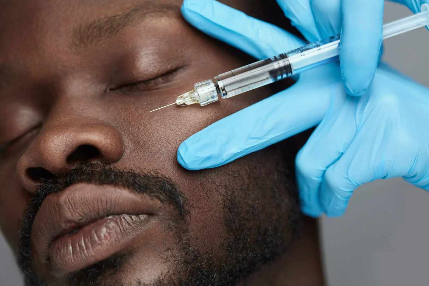 Botox being injected to a man