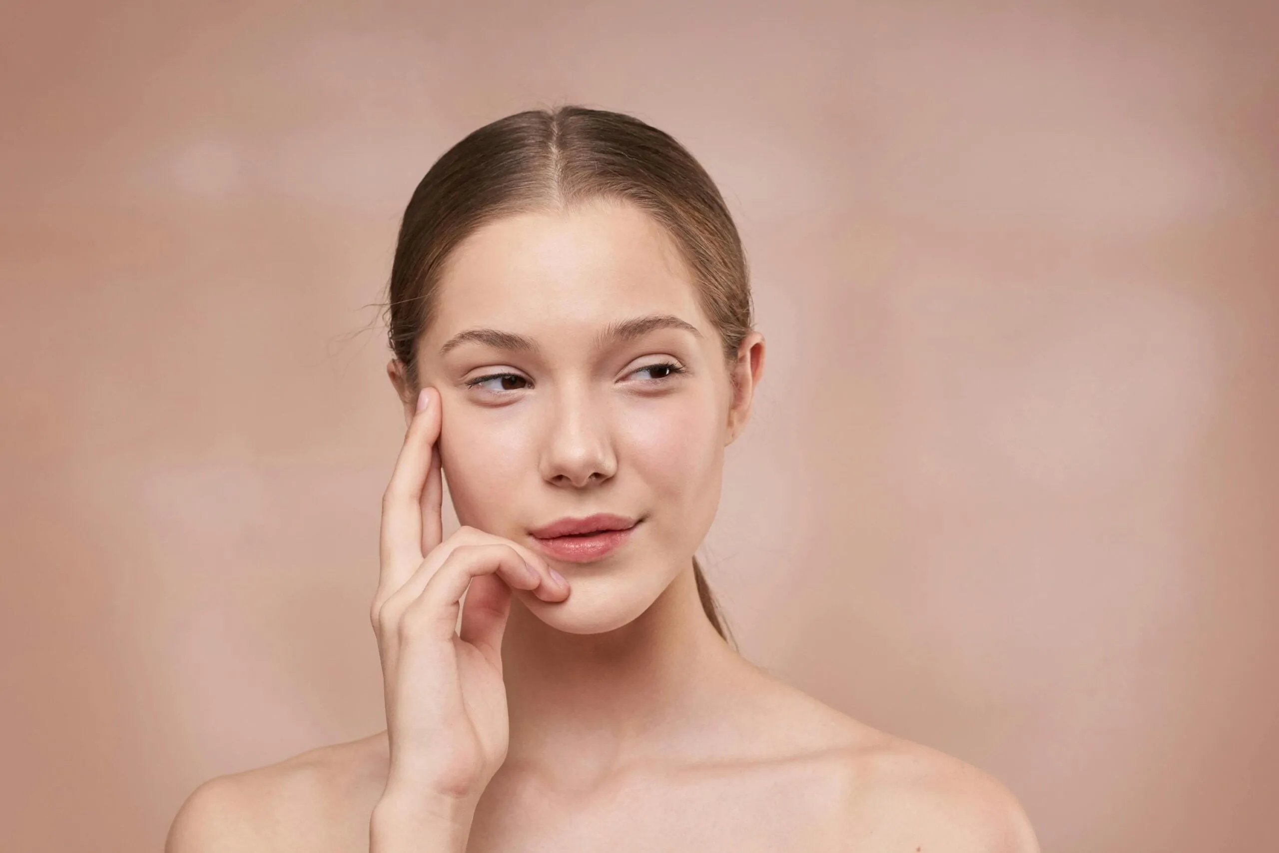 Woman admiring face after plastic surgery