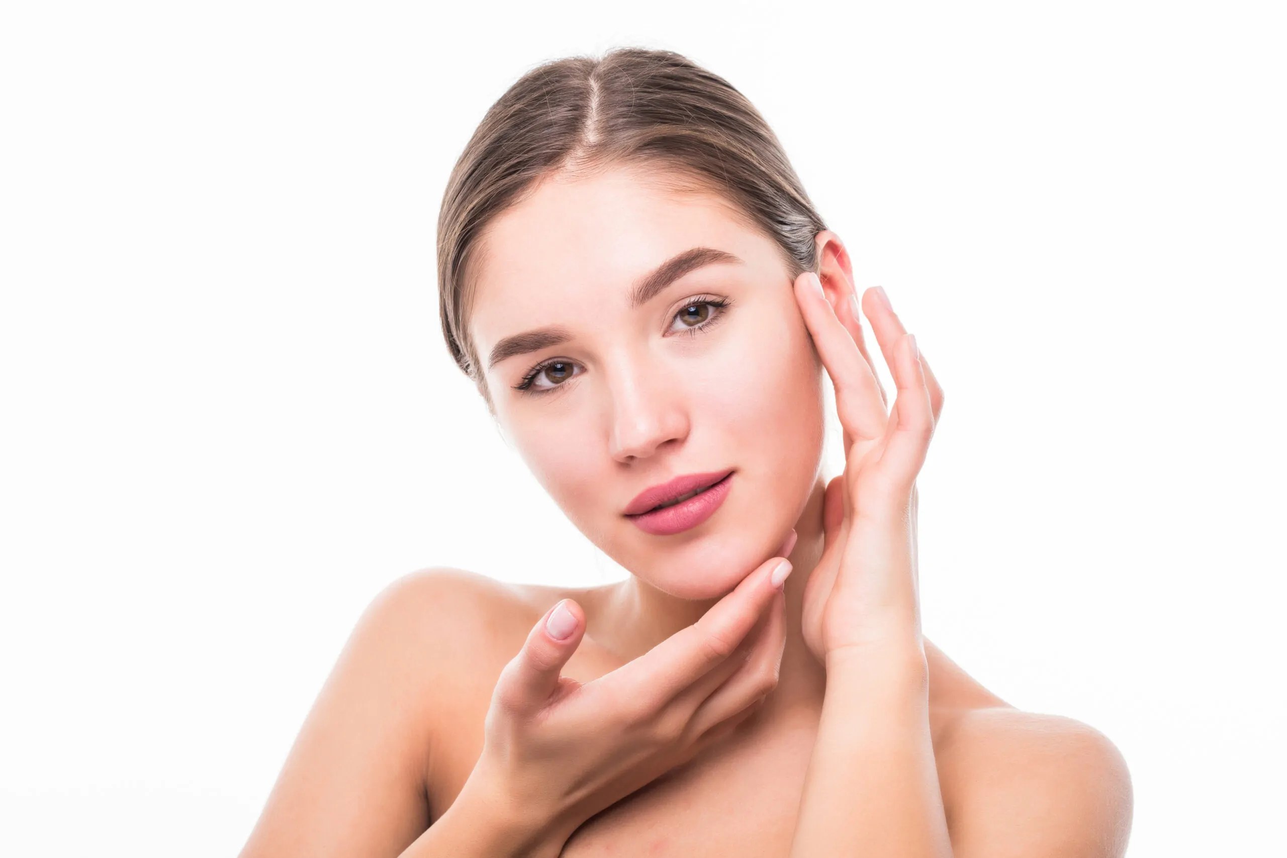 Beautiful spa woman touching her face isolated on white background.