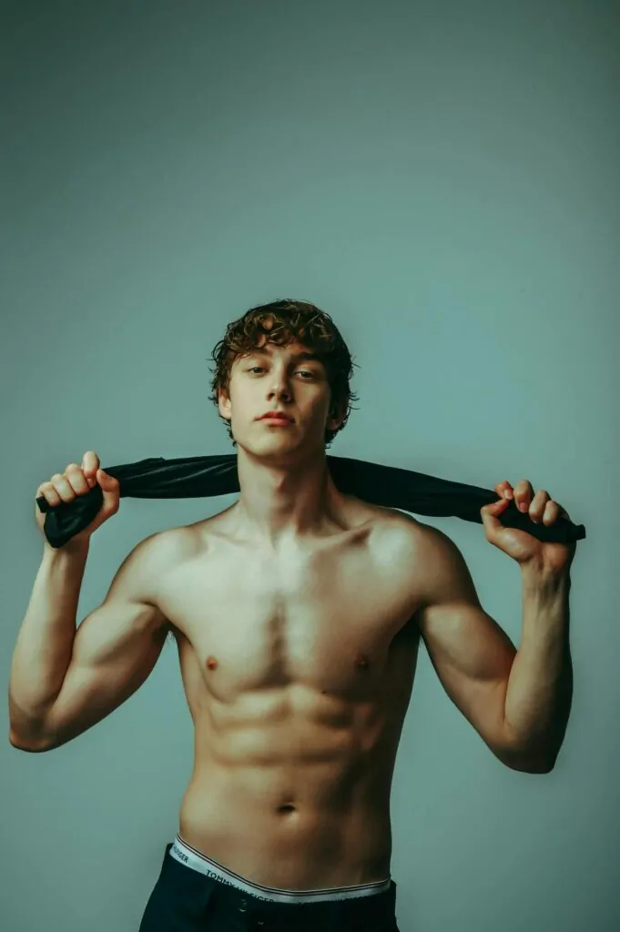 a shirtless person showing off their abs
