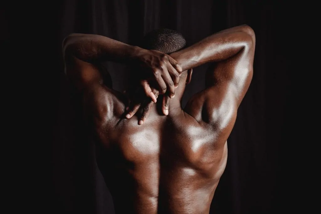 back view of a man posing shirtless