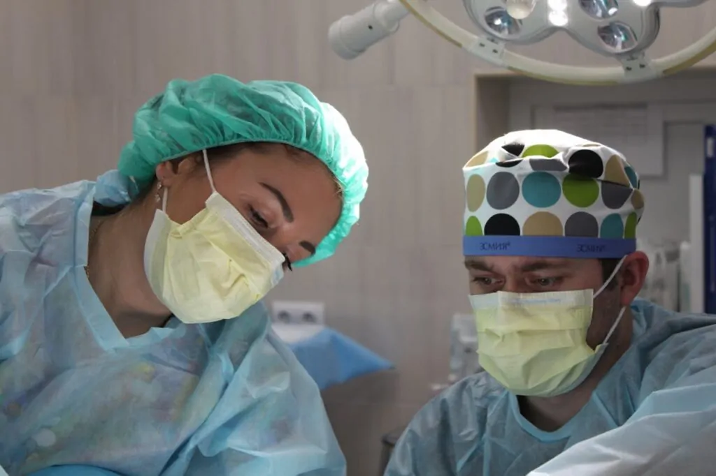 two plastic surgeons discussing liposuction